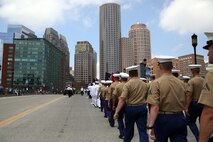Marines and sailors march through the streets during the Sail Boston 2017 street parade held in Boston, Mass., June 19, 2017. Marines, sailors and various participants of Sail Boston paraded the streets in celebration of the occasion. Sail Boston brought together military members and sailing enthusiasts from around the world, welcoming them to sail the Boston harbor, interact with the community, and enjoy the sights of the city. (U.S. Marine Corps photo by Cpl. Mackenzie Gibson/Released)