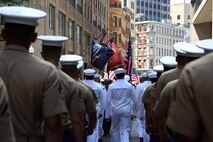 Marines and Sailors march through the streets during the Sail Boston 2017 street parade held in Boston, Mass., June 19, 2017. Marines, Sailors and various participants of Sail Boston paraded the streets in celebration of the occasion. Sail Boston brought together military members and sailing enthusiasts from around the world, welcoming them to sail the Boston harbor, interact with the community, and enjoy the sights of the city. (U.S. Marine Corps photo by Cpl. Mackenzie Gibson/Released)