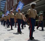 Marines march through the streets during the Sail Boston 2017 street parade held in Boston, Mass., June 19, 2017. Marines, Sailors and various participants of Sail Boston paraded the streets in celebration of the occasion. Sail Boston brought together military members and sailing enthusiasts from around the world, welcoming them to sail the Boston harbor, interact with the community, and enjoy the sights of the city. (U.S. Marine Corps photo by Cpl. Mackenzie Gibson/Released)