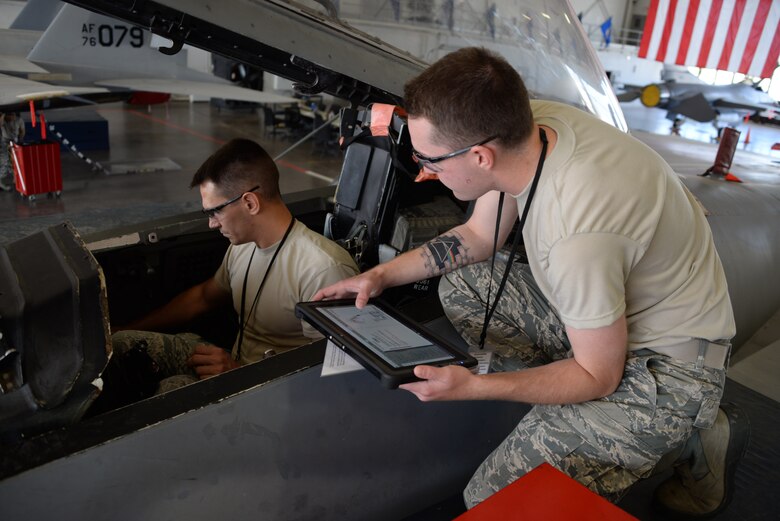 Airmen Adam Brenteson and Brady Hendricks, 364th Training Squadron electrical and environmental apprentice course students,  remove a broken oxygen regulator on the F-15D Eagle during training. A steady oxygen supply to the pilot is crucial to maintain consciousness at certain altitudes. (U.S Air Force photo by Senior Airman Robert L. McIlrath)