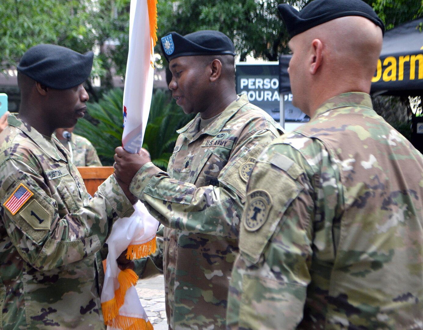Col. Terance L. Huston (left), U.S. Army 5th Recruiting Brigade commander, passes the guidon to Lt. Col. D’Angelo A. Blount, the San Antonio Recruiting Battalion incoming commander, signifying the official change of command in front of the Alamo in downtown San Antonio June 29. 