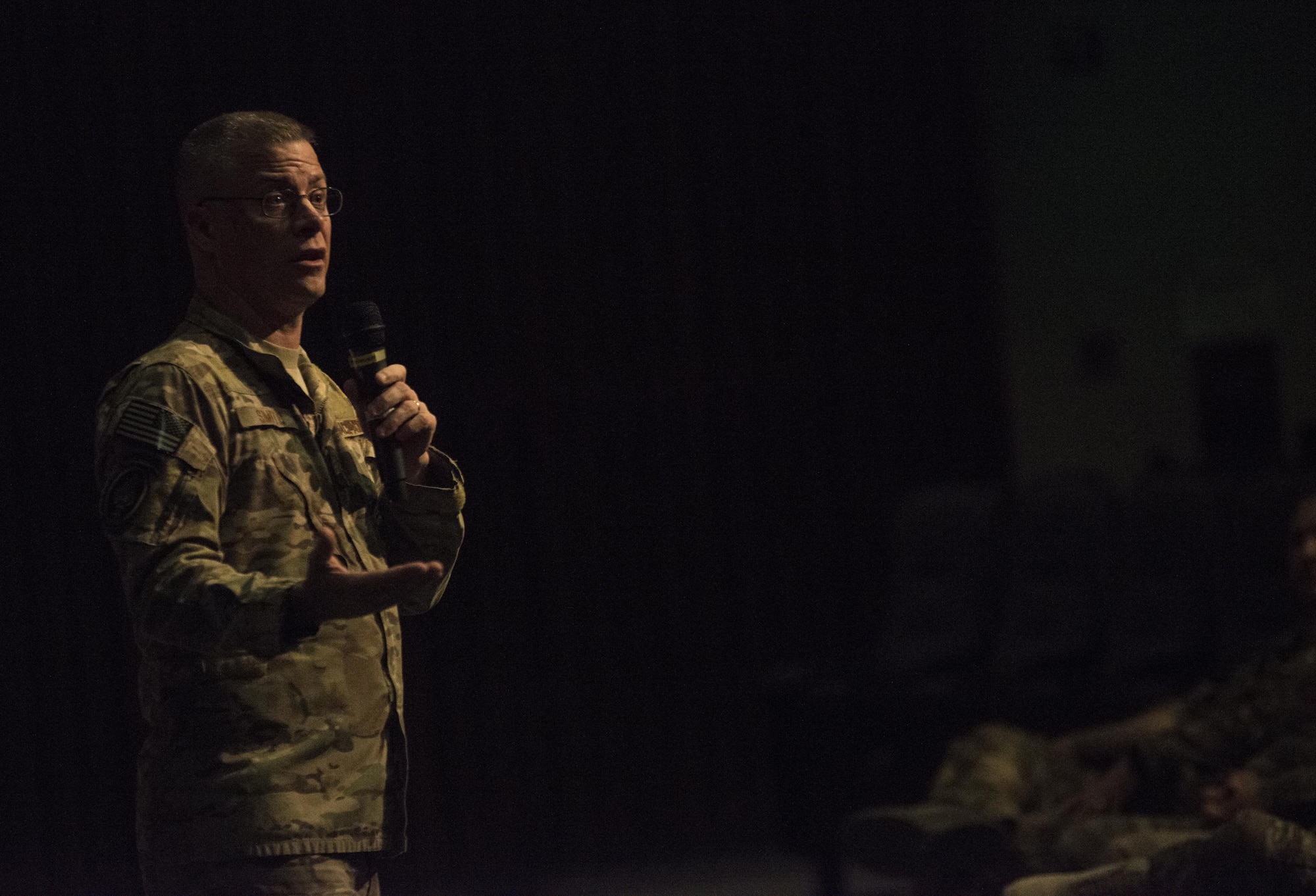 Air Force Special Operations Command Chief Master Sgt. Gregory Smith addresses the enlisted members of the 353rd Special Operations Group during an all-call June 19, 2017 at Kadena Air Base, Okinawa, Japan. Smith took the opportunity to address Airmen on changes to developmental special duties, enlisted performance evaluations, enlisted professional military education and the blended retirement system. (U.S. Air Force photo by Capt. Jessica Tait)