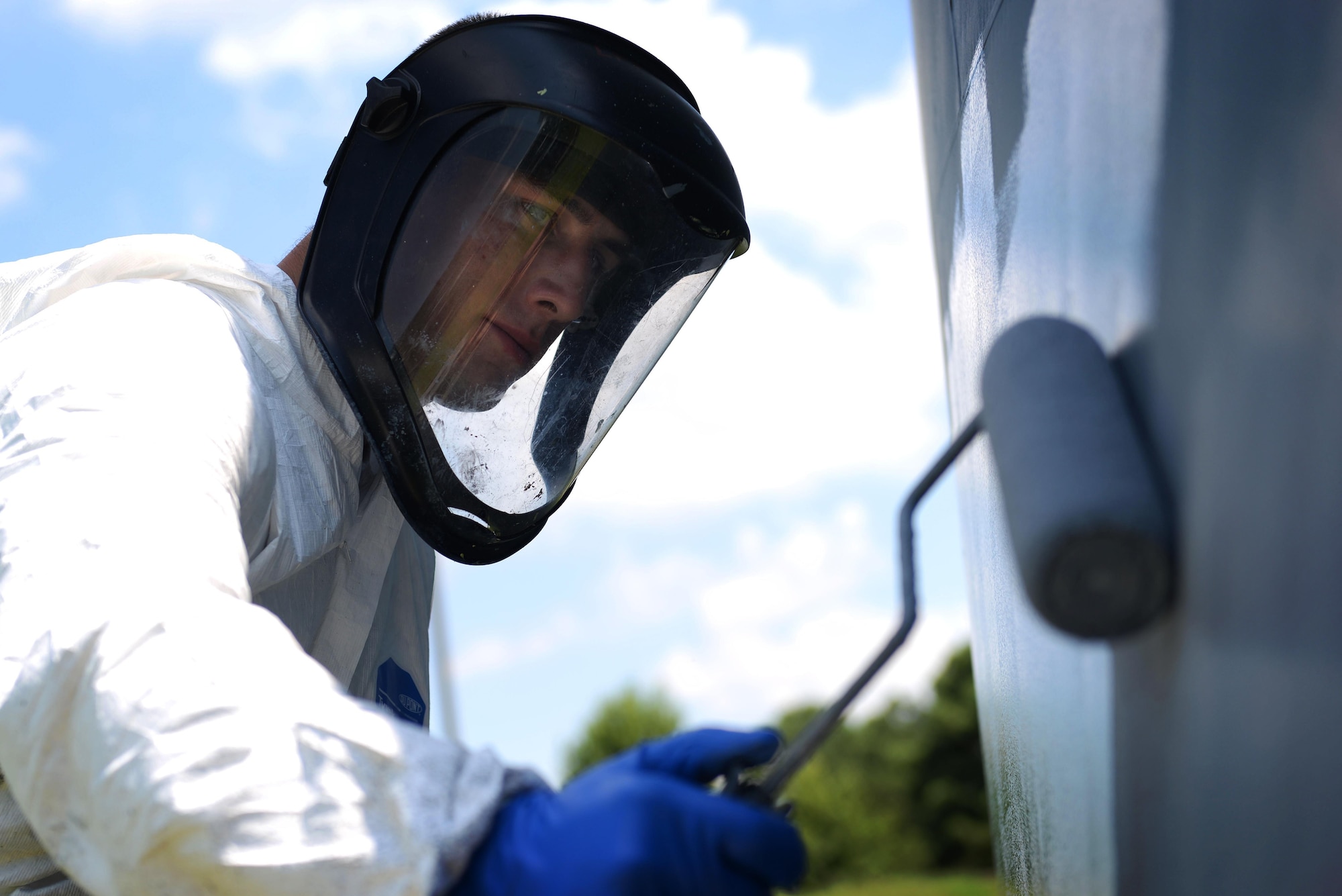 Airman 1st Class Steven Stoy, 19th Maintenance Squadron aircraft structural maintainer, applies a coat of paint to a static display of a C-130J tail June 27, 2017, at Little Rock Air Force Base, Ark. Corrosion control Airmen use a specific technique while painting. (U.S. Air Force photo by Airman Rhett Isbell)