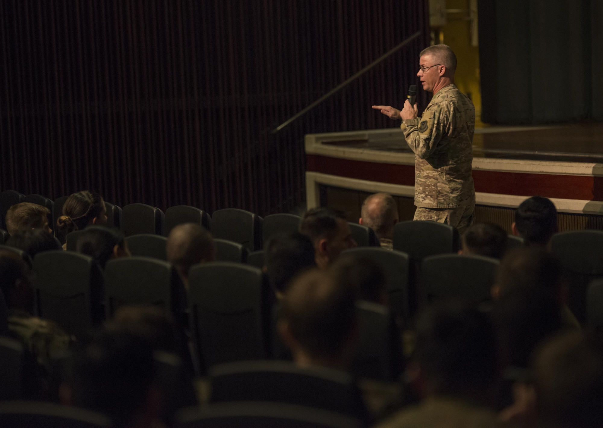 Enlisted members of the 353rd Special Operations Group listen to Air Force Special Operations Command Chief Master Sgt. Gregory Smith during an all-call June 19, 2017 at Kadena Air Base, Okinawa, Japan. Smith described the significance of these changes, provided resources and emphasized the choices Airmen need to make. (U.S. Air Force photo by Capt. Jessica Tait)