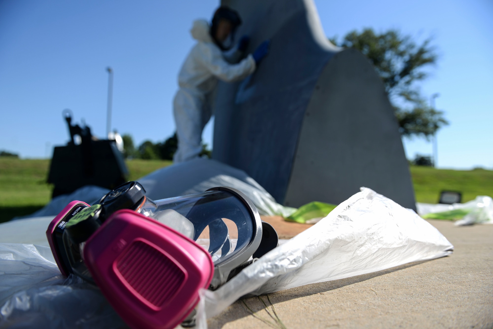 Senior Airman Wesley Garnes, 19th Maintenance Squadron aircraft structural maintainer, wipes away dust after sanding the paint off of the C-130J tail static display June 27, 2017, at Little Rock Air Force Base, Ark. The Airmen working on the C-130J tail static display performed different steps of the paint restoration. (U.S. Air Force photo by Airman Rhett Isbell)