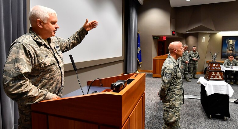 WRIGHT-PATTERSON AIR FORCE BASE, Ohio -- Lt. Gen. L. Scott Rice, Air National Guard director, accepts the 2016 Air Force Marathon MAJCOM Challenge trophy with members of his winning team June 27, 2017, during the annual CORONA Top conference held at Headquarters Air Force Materiel Command. The presentation took place before a crowd of the Air Force’s senior leadership gathered here for a series of top-level meetings. The MAJCOM Challenge serves as a friendly service-wide competition that challenges each major command to encourage its respective Airmen to participate in the annual race. This year’s 21st annual Air Force Marathon is scheduled for Sept. 16, 2017. (U.S. Air Force photo/Scott M. Ash)