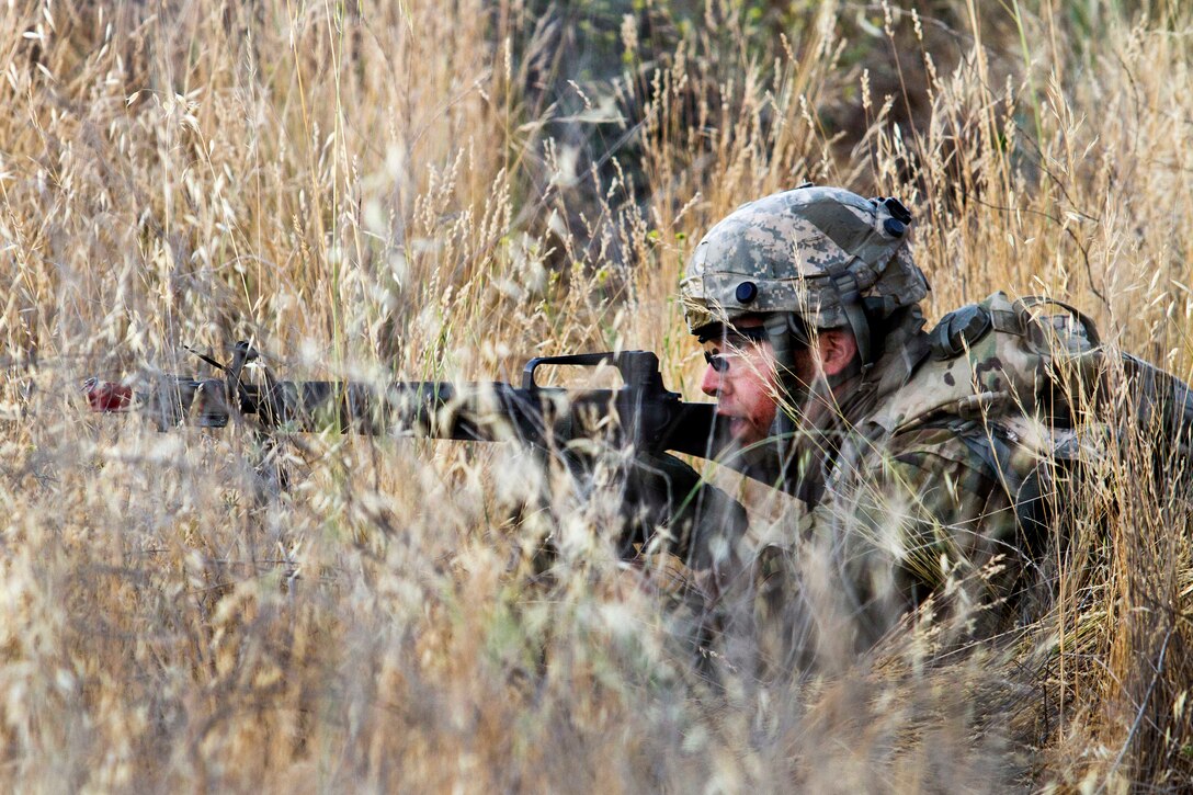 An Army reservist returns fire on opposition forces during a training mission, part of Warrior Exercise at Fort Hunter Liggett, Calif., June 20, 2017. Army photo by Spc. Derek Cummings