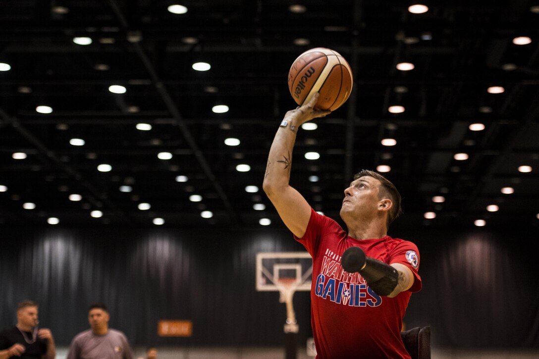 Marine Corps Sgt. Mike Nicholson takes a shot during wheelchair basketball practice for the 2017 Department of Defense Warrior Games in Chicago, June 29, 2017. The DoD Warrior Games are an annual event allowing wounded, ill and injured service members and veterans to compete in Paralympic-style sports. DoD photo by EJ Hersom