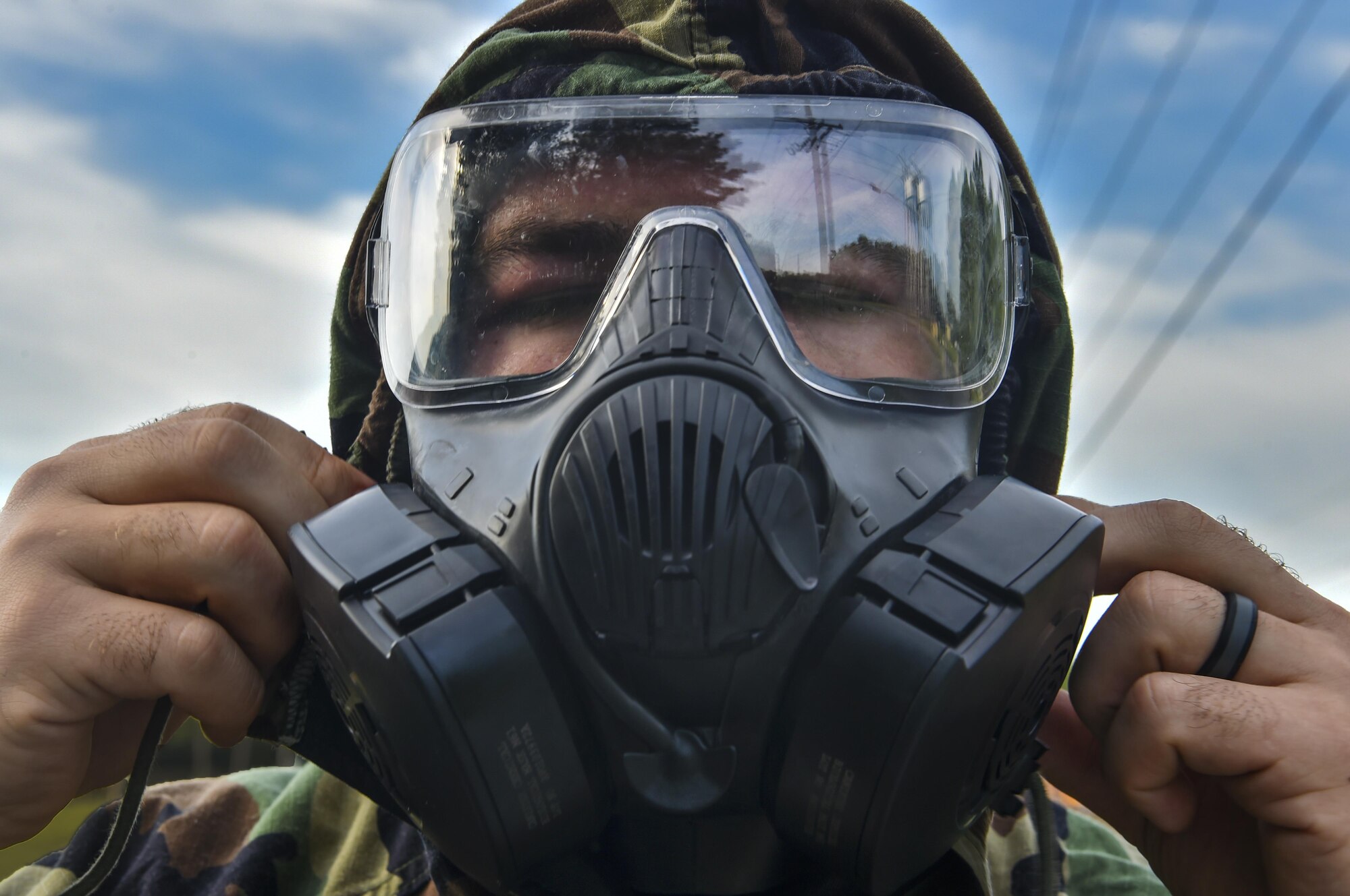 Senior Airman Dylan Babb, 628th Civil Engineer Squadron explosive ordnance disposal technician, dons a gas mask during training, June 28, 2017. EOD here trained over the course of a week to ensure they are retaining knowledge and can efficiently use their skillsets in real world situations. 