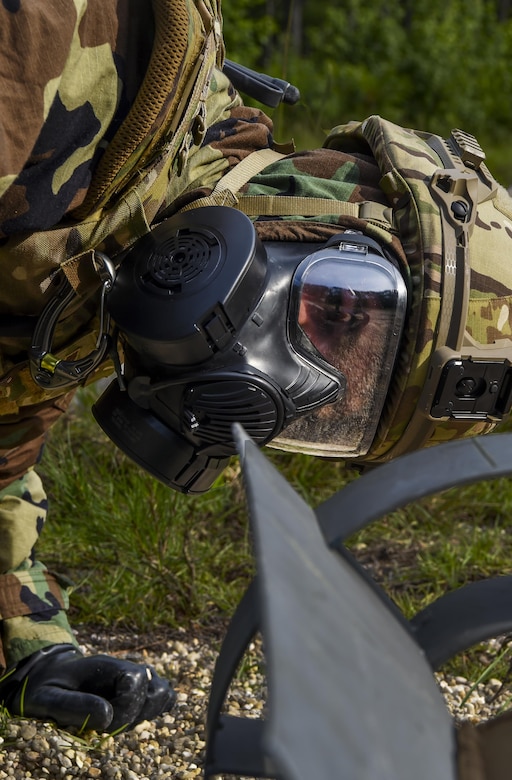 Senior Airman Dylan Babb, 628th Civil Engineer Squadron explosive ordnance disposal technician, performs reconnaissance on unexploded ordnance, June 28, 2017. During training operation Mogul Wrath teams completed training events using various practical skills, EOD specialized equipment and scenario-based, full spectrum emergency responses. 
