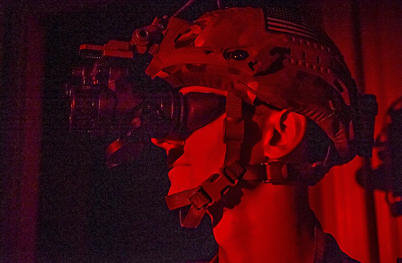 Senior Airman Michael Frook, 628th Civil Engineer Squadron explosive ordnance disposal technician, uses his night vision goggles during training exercise Mogul Wrath, June 29, 2017. The training operation incorporated nighttime operations, wartime expedient chemical munition procedures and tactical vehicle operations. 