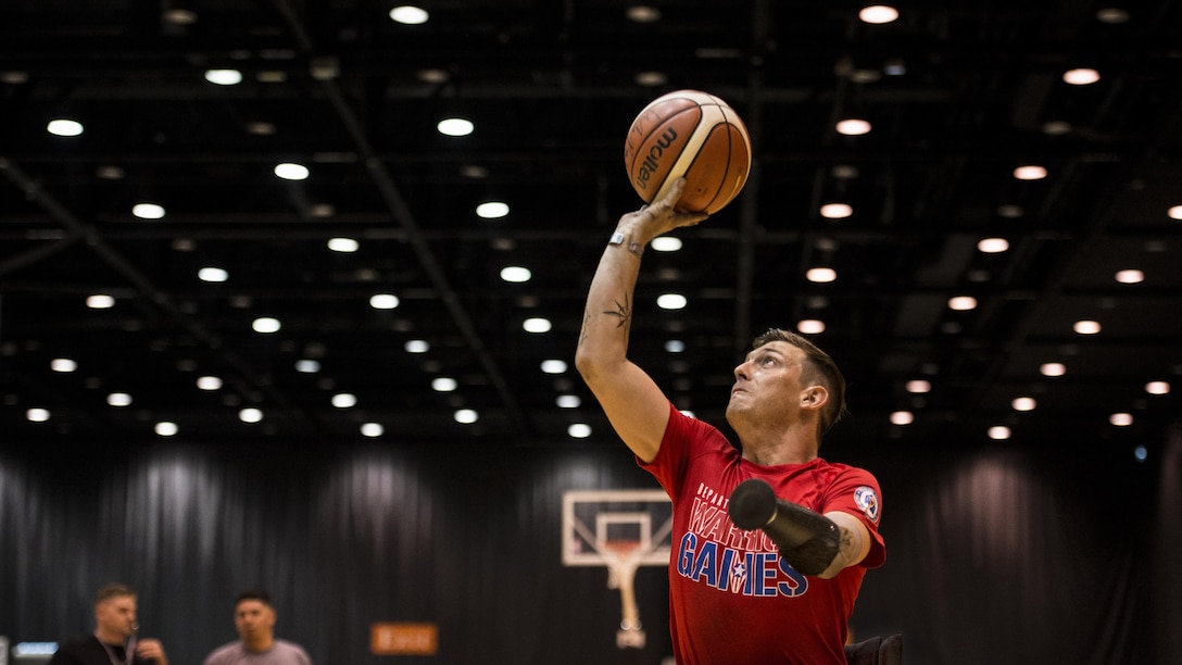 Marine Corps Sgt. Mike Nicholson takes a shot during wheelchair basketball practice for the 2017 DoD Warrior Games in Chicago, June 29, 2017. The annual event allows wounded, ill and injured service members and veterans to compete in Paralympic-style sports. DoD photo by EJ Hersom