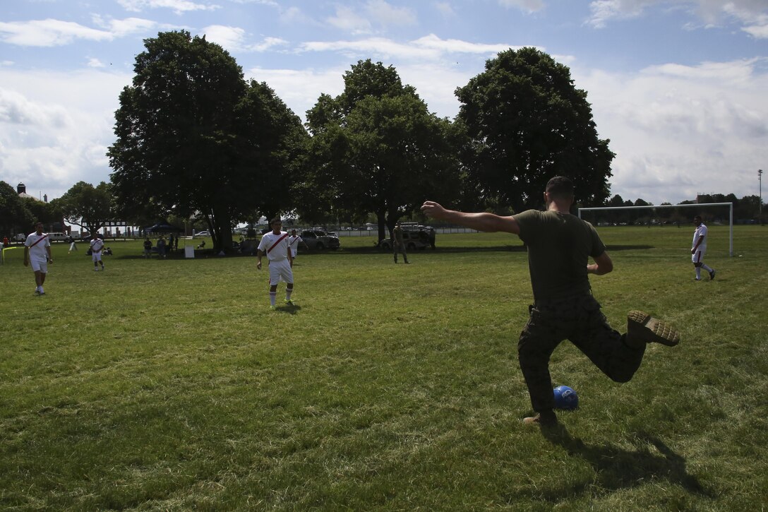 Lance Cpl. Scott Harder winds up to kick the ball to his teammates during the Sail Boston 2017 Soccer Tournament held at Joe Moakley Park in Boston, Mass., June 20, 2017. The tournament was a friendly competition aimed at establishing rapport among service members from around the world and others participating in Sail Boston. Marines and Sailors from countries including Chile, Peru, and Ecuador attended the tournament. Harder is a motor transport specialist assigned to Combat Logistics Battalion 8, Combat Logistics Regiment 2, 2nd Marine Logistics Battalion. (U.S. Marine Corps photo by Cpl. Mackenzie Gibson/Released) 