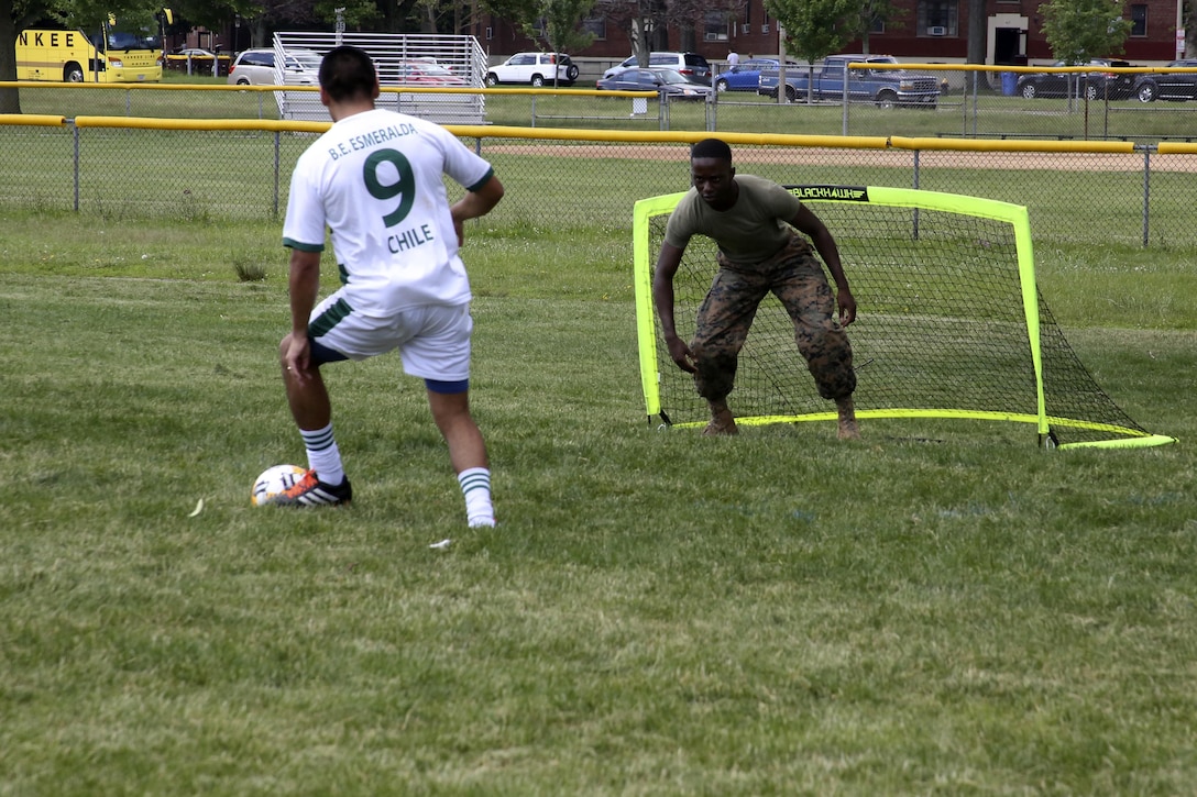 Cpl. Courtney Young protects his goal during the Sail Boston 2017 Soccer Tournament held at Joe Moakley Park in Boston, Mass., June 20, 2017. The tournament was a friendly competition aimed at establishing rapport among service members from around the world and others participating in Sail Boston. Marines and Sailors from countries including Chile, Peru, and Ecuador attended the tournament. Marines and Sailors from countries including Chile, Peru, and Ecuador attended the tournament. Young is a food service specialist assigned to Marine Wing Support Squadron 271, Marine Aircraft Group 14, 2nd Marine Aircraft Wing. (U.S. Marine Corps photo by Cpl. Mackenzie Gibson/Released)