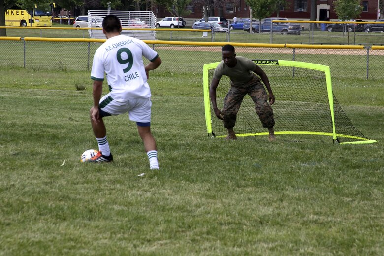Cpl. Courtney Young protects his goal during the Sail Boston 2017 Soccer Tournament held at Joe Moakley Park in Boston, Mass., June 20, 2017. The tournament was a friendly competition aimed at establishing rapport among service members from around the world and others participating in Sail Boston. Marines and Sailors from countries including Chile, Peru, and Ecuador attended the tournament. Marines and Sailors from countries including Chile, Peru, and Ecuador attended the tournament. Young is a food service specialist assigned to Marine Wing Support Squadron 271, Marine Aircraft Group 14, 2nd Marine Aircraft Wing. (U.S. Marine Corps photo by Cpl. Mackenzie Gibson/Released)