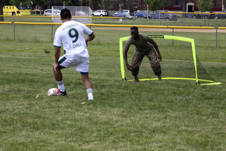 Cpl. Courtney Young protects his goal during the Sail Boston 2017 Soccer Tournament held at Joe Moakley Park in Boston, Mass., June 20, 2017. The tournament was a friendly competition aimed at establishing rapport among service members from around the world and others participating in Sail Boston. Marines and Sailors from countries including Chile, Peru, and Ecuador attended the tournament. Marines and Sailors from countries including Chile, Peru, and Ecuador attended the tournament. Young is a food service specialist assigned to Marine Wing Support Squadron 271, Marine Aircraft Group 14, 2nd Marine Aircraft Wing. (U.S. Marine Corps photo by Cpl. Mackenzie Gibson/Released)