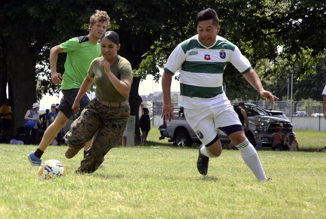 Lance Cpl. Jailine Martinez sprints for the ball during the Sail Boston 2017 Soccer Tournament held at Joe Moakley Park in Boston, Mass., June 20, 2017. The tournament was a friendly competition aimed at establishing rapport among service members from around the world and others participating in Sail Boston. Marines and Sailors from countries including Chile, Peru, and Ecuador attended the tournament. Martinez is a combat photographer assigned to Marine Wing Headquarters Squadron 2, Marine Aircraft Group 14, 2nd Marine Aircraft Wing. (U.S. Marine Corps photo by Cpl. Mackenzie Gibson/Released) 