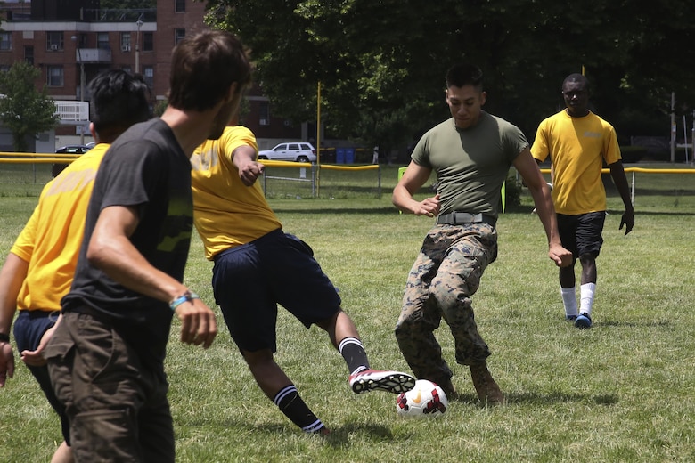 Cpl. Marco Martinez dribbles the ball up the field during the Sail Boston 2017 Soccer Tournament held at Joe Moakley Park in Boston, Mass., June 20, 2017. The tournament was a friendly competition aimed at establishing rapport among service members from around the world and others participating in Sail Boston. Marines and Sailors from countries including Chile, Peru, and Ecuador attended the tournament. Martinez is a cyber network operator assigned Combat Logistics Battalion 8, Combat Logistics Regiment 2, 2nd Marine Logistics Battalion. (U.S. Marine Corps photo by Cpl. Mackenzie Gibson/Released) 