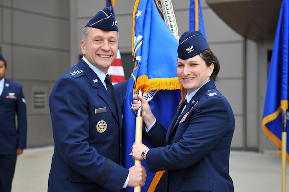 Lt. Gen. David J. Buck, commander, 14th Air Force (Air Forces Strategic) and Joint Functional Component Command for Space, welcomes Col. Jennifer Grant to her new post as 50th Space Wing commander during the wing's change of command ceremony Friday, June 30, 2017 at Schriever Air Force Base, Colorado. Grant returns to command at Schriever as she previously commanded the 2nd Space Operations Squadron. (U.S. Air Force photo/Dennis Rogers)
