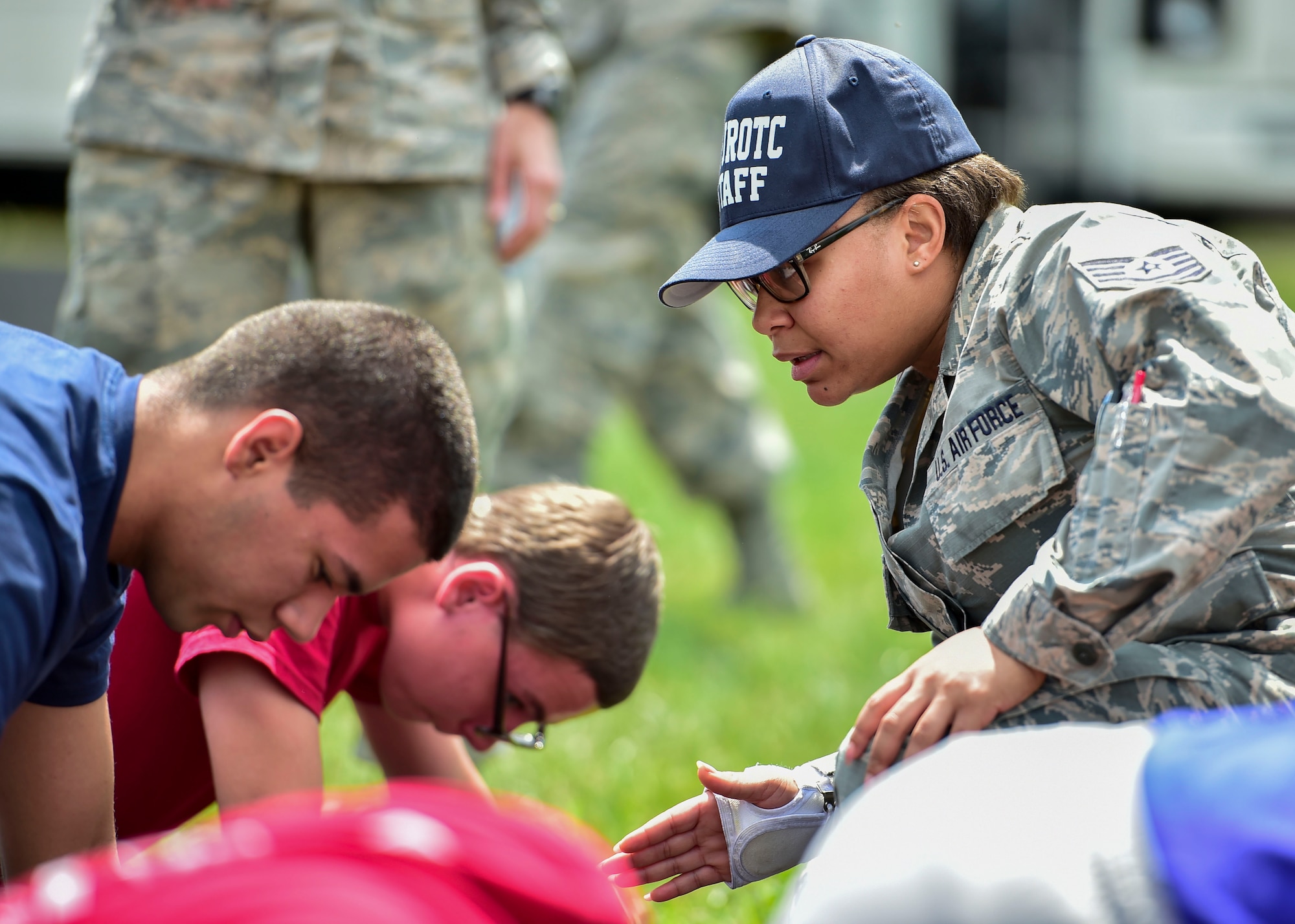 U.S. Air Force Reserve Tech. Sgt. Kristen Howard, a member of the 910th Medical Squadron, supervises Junior Reserve Officer Training Corps (JROTC) cadets doing physical training during an encampment here, June 21, 2017. The encampment, facilitated by 910th Airlift Wing Airmen, provided a five-day experience teaching military skills and replicating aspects of Basic Military Training. JROTC is a program sponsored by the Armed Forces for high school students across the country. (U.S. Air Force photo/Eric White)