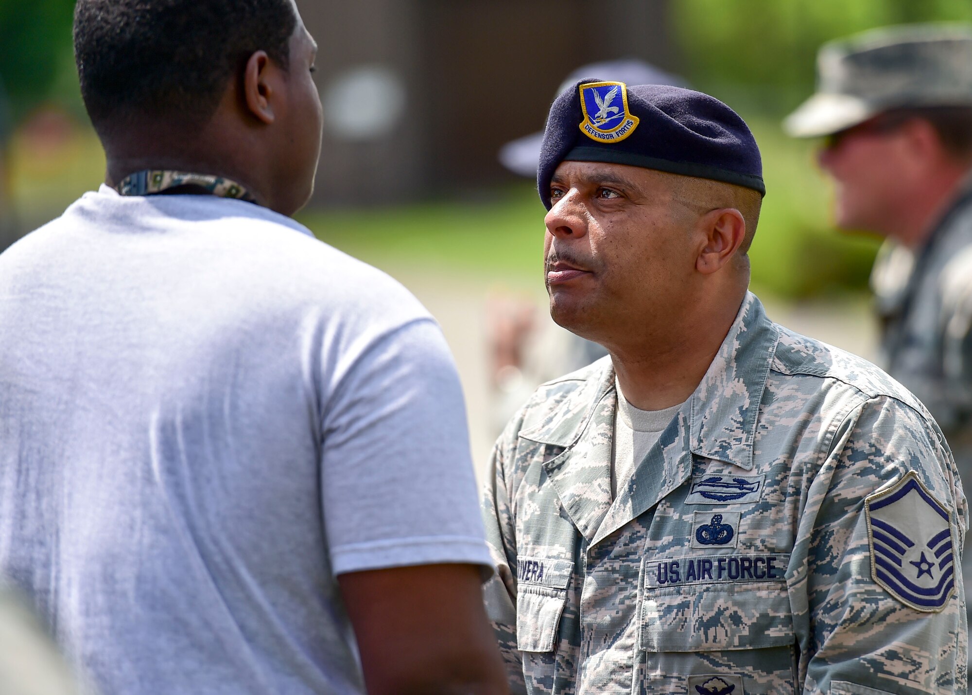 U.S. Air Force Citizen Airman Master Sgt. Jose Rivera, a member of the 910th Security Forces Squadron, addresses a Junior Reserve Officer Training Corps (JROTC) cadet during an encampment here, June 21, 2017. The encampment, facilitated by 910th Airlift Wing Airmen, provided a five-day experience teaching military skills and replicating aspects of Basic Military Training. JROTC is a program sponsored by the Armed Forces for high school students across the country. (U.S. Air Force photo/Eric White)