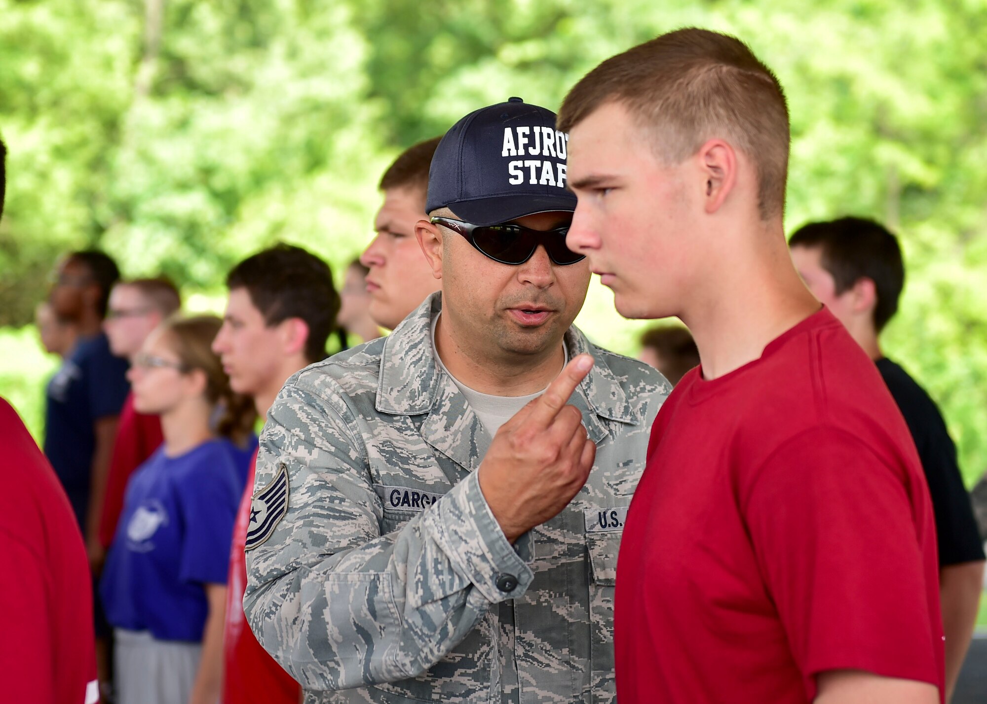 U.S. Air Force Citizen Airman Tech. Sgt. Florin Gargarita, a member of the 910th Maintenance Squadron, directs a Junior Reserve Officer Training Corps (JROTC) cadet to assume correct posture during an encampment here, June 21, 2017. The encampment, facilitated by 910th Airlift Wing Airmen, provided a five-day experience teaching military skills and replicating aspects of Basic Military Training. JROTC is a program sponsored by the Armed Forces for high school students across the country. (U.S. Air Force photo/Eric White)