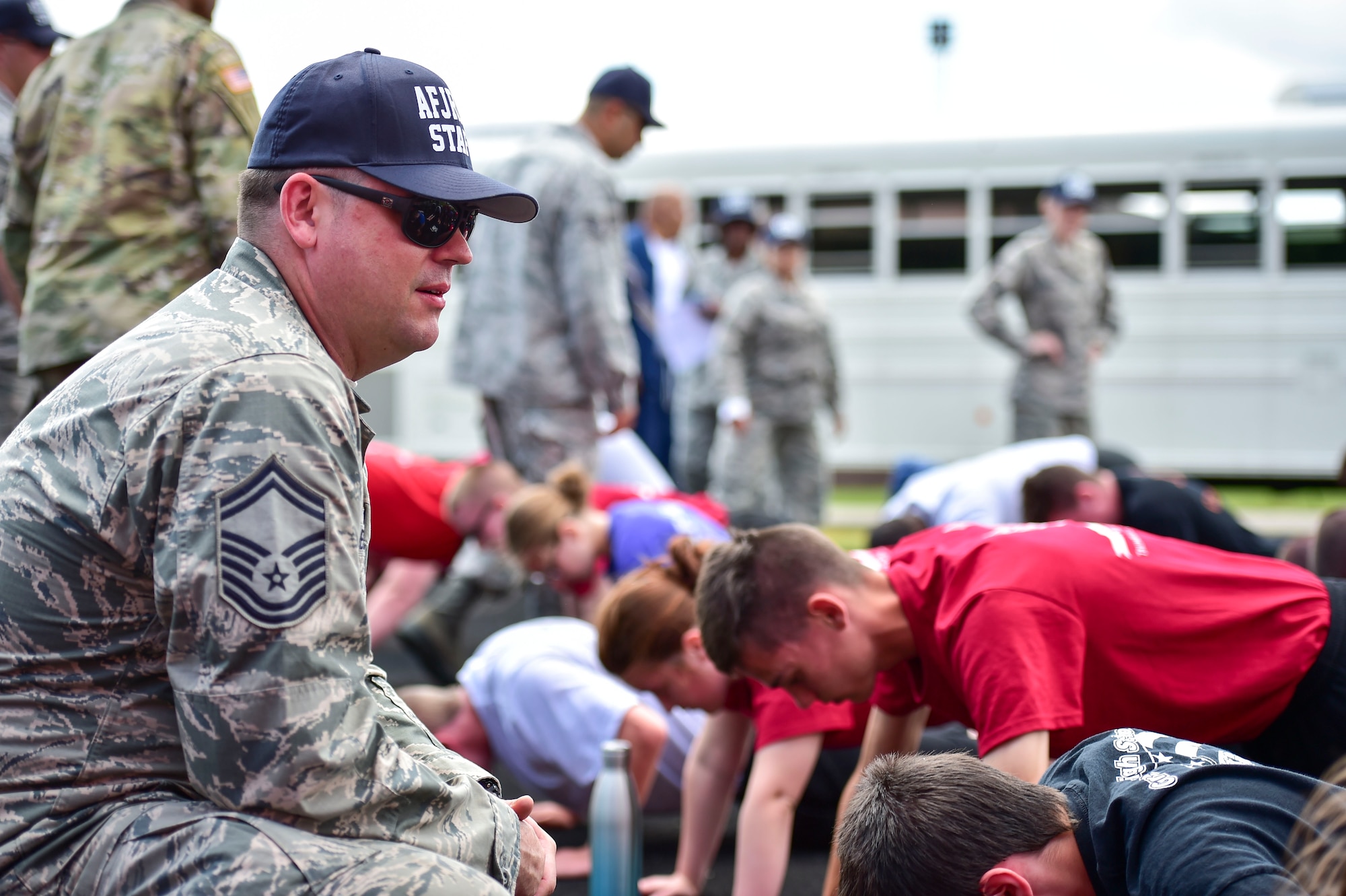 U.S. Air Force Citizen Airman Senior Master Sgt. James Jesionowski, a member of the 910th Medical Squadron, supervises physical training for Junior Reserve Officer Training Corps (JROTC) cadets during an encampment here, June 21, 2017. The encampment, facilitated by 910th Airlift Wing Airmen, provided a five-day experience teaching military skills and replicating aspects of Basic Military Training. JROTC is a program sponsored by the Armed Forces for high school students across the country. (U.S. Air Force photo/Eric White)