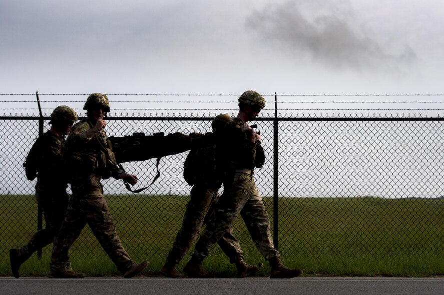 Airmen from the 822d Base Defense Squadron carry a litter during the Scorpion Fire Team Challenge, June 28, 2017, at Moody Air Force Base, Ga. The challenge was designed to push the Airmen to their physical and mental limits, by incorporating written tests, hostage rescues, blindfolded weapons assembly and physical exertion sessions among 14 other challenges. Eighteen four-person teams competed during the two-day event for various prizes and bragging rights. (U.S. Air Force photo by Senior Airman Janiqua P. Robinson)