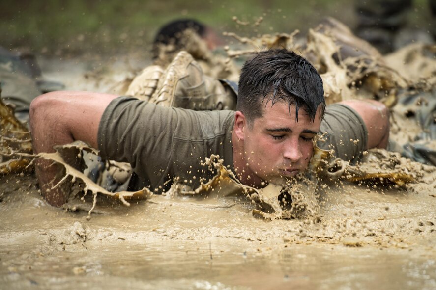 Senior Airman Daniel Keller, 822d Base Defense Squadron fireteam member, performs team push-ups during the Scorpion Fire Team Challenge, June 29, 2017, at Moody Air Force Base, Ga. The challenge was designed to push the Airmen to their physical and mental limits, by incorporating written tests, hostage rescues, blindfolded weapons assembly and physical exertion sessions among 14 other challenges. Eighteen four-person teams competed during the two-day event for various prizes and bragging 