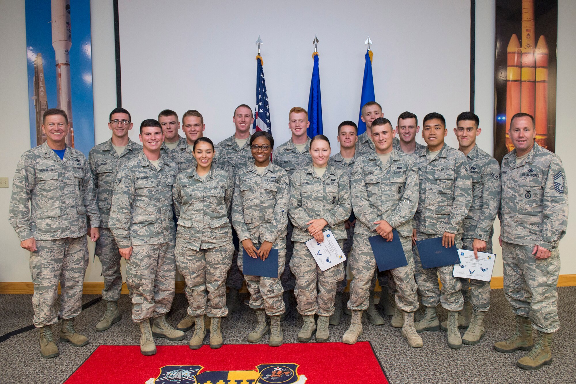 Fifteen Airmen who completed the first Airmanship 300 course pose for a photo June 30, 2017, at the First Term Airmen Center, Patrick Air Force Base, Fla.  The new course is a continuation of the training the Air Force military personnel received at Basic Military Training (Airman 100) and technical training (Airman 200), building upon the skills they’ve already been introduced to.  The First Term Airmen Center recently transitioned to the Air Force’s new professional development curriculum with a focus on developing Airmen as next-generation leaders. (U.S. Air Force photo by Matthew Jurgens)