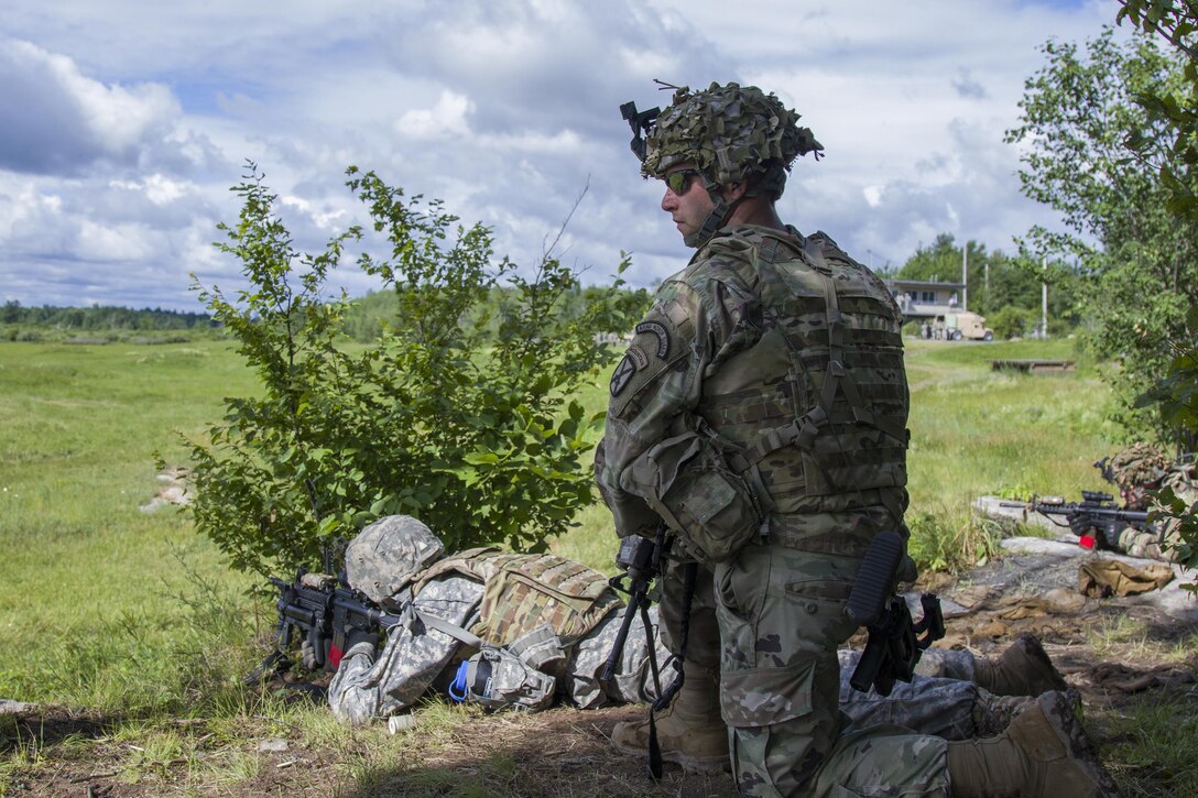 Army Sgt. Travis Rock, foreground, observes his team's follow-on objective during a live-fire exercise at Fort Drum, N.Y., June 21, 2017. Rock is a team leader assigned to the Vermont Army National Guard’s Charlie Troop, 1st Squadron, 172nd Cavalry Regiment, 86th Infantry Brigade Combat Team (Mountain). Army National Guard photo by Spc. Avery Cunningham
