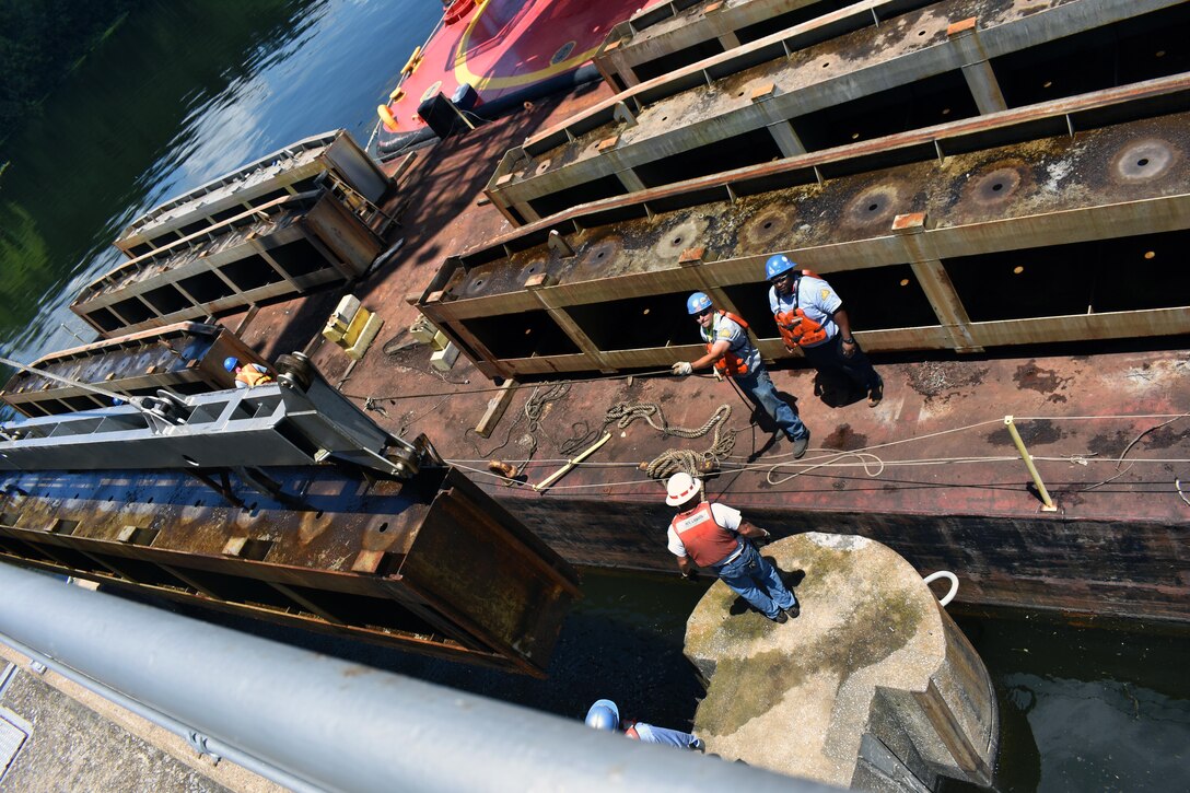 Contractors replaced the two main electric power feeders that extend the length of the spillway. Workers at the dam reworked the 14 panel boxes, one at each gate, and replaced all components of the control boxes including installing new load circuit breakers, brake transformers control power transformers and all new wiring.