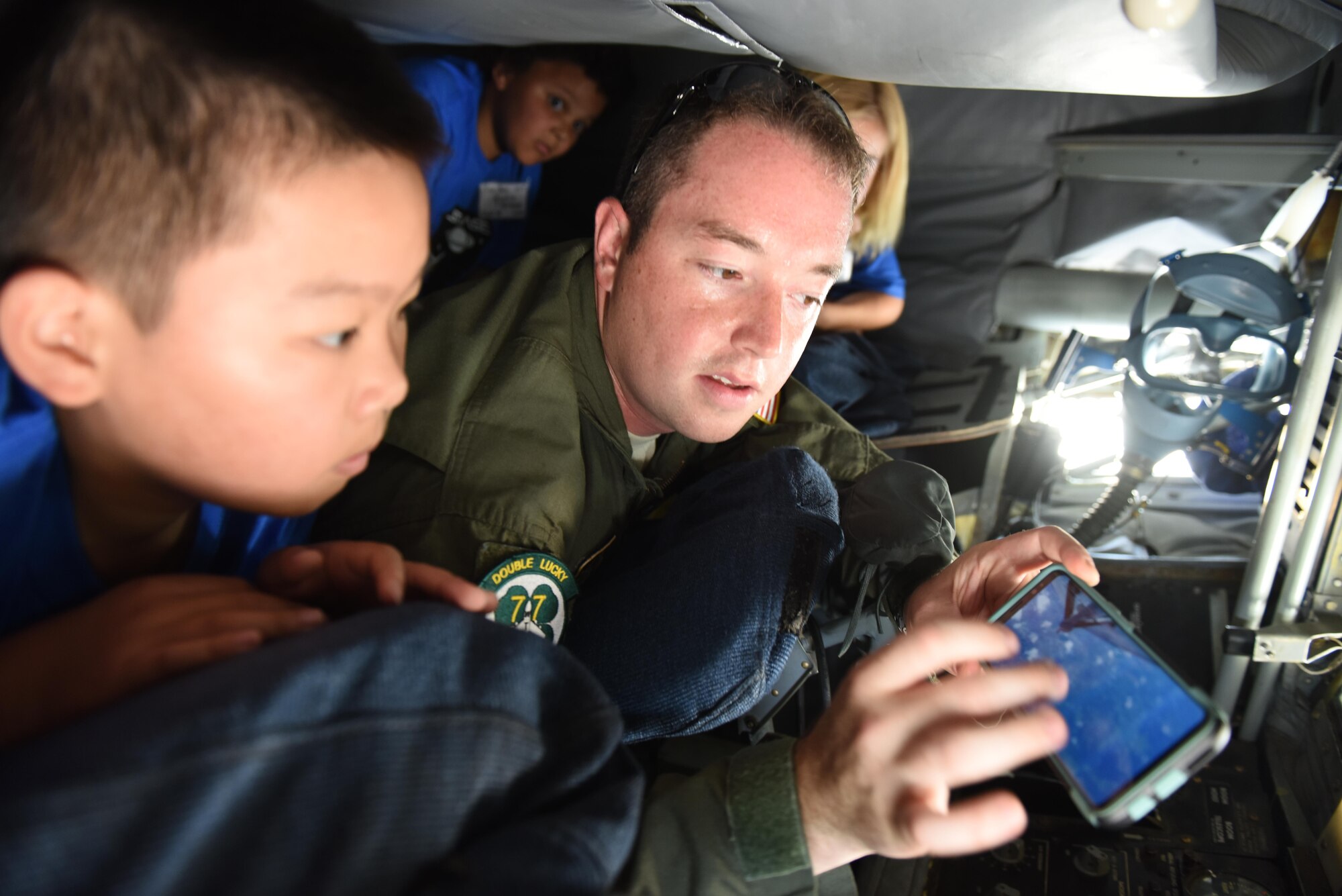 Staff Sgt. Noah Starnes, 77th Air Refueling Squadron boom operator, explains the mission of the KC-135 Stratotanker to Science and Technology Academies Reinforcing Basic Aviation and Space Exploration program students, June 19, 2017, at Seymour Johnson Air Force Base, North Carolina. STARBASE is a weeklong program that allows rising fifth-grade students to tour Seymour Johnson AFB and learn about several military career fields and the science behind them. (U.S. Air Force photo by Senior Airman Ashley Maldonado)