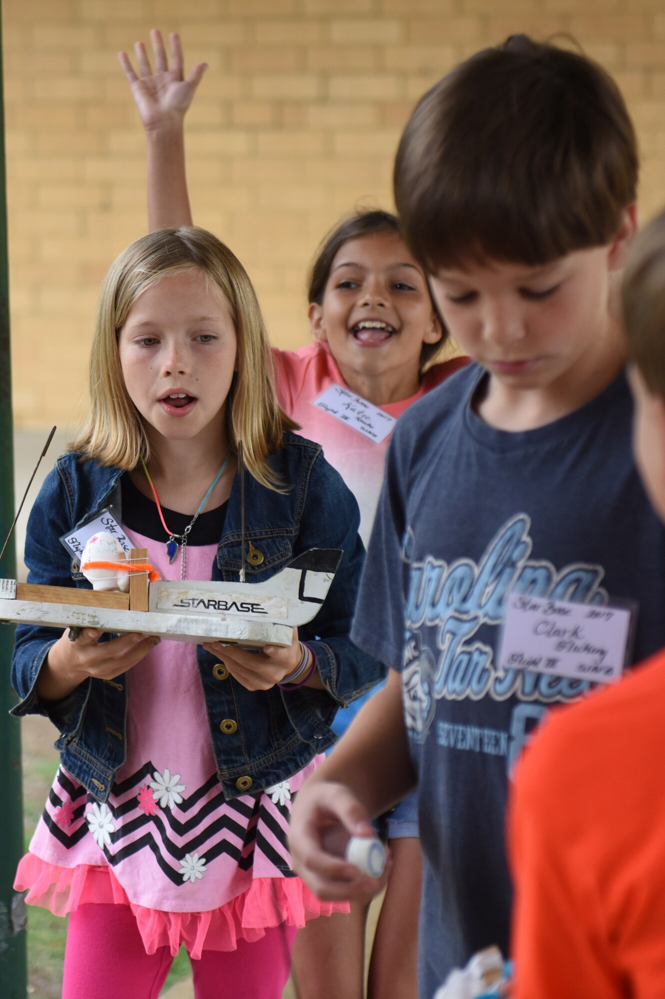 Science and Technology Academies Reinforcing Basic Aviation and Space Exploration program students learn the effects of gravity, June 20, 2017, at Greenwood Middle School in Goldsboro, North Carolina.Before touring Seymour Johnson Air Force Base, STARBASE students performed experiments to learn the science behind aircraft flight. (U.S. Air Force photo by Senior Airman Ashley Maldonado)
