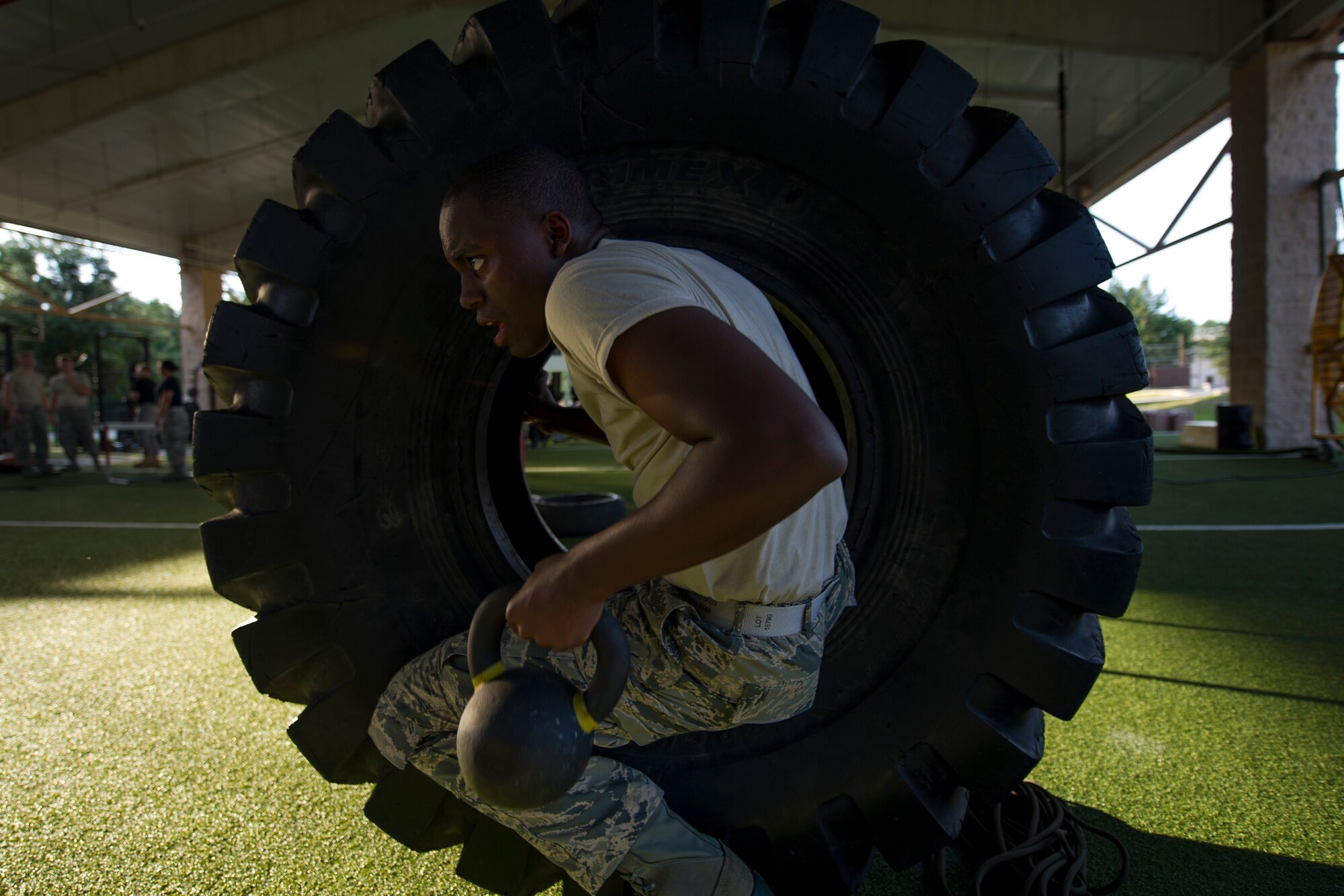 A Junior ROTC cadet climbs through a tire at the end of an obstacle course at the Special Tactics Training Squadron, Hurlburt Field, Fla., June 26, 2017. The JROTC Summer Leadership School program brought more than 50 cadets to Hurlburt Field to engage in a variety of team-building and leadership skill-developing exercise under the guidance of Air Commandos, June 26 – 30. (U.S. Air Force photo by Staff Sgt. Victor J. Caputo)