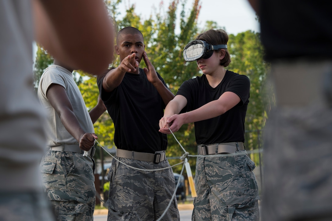 A Junior ROTC cadet tries to verbally direct blindfolded cadets during a team-building exercise at Hurlburt Field, Fla., June 26, 2017. The JROTC Summer Leadership School program brought more than 50 cadets to Hurlburt Field to engage in a variety of team-building and leadership skill-developing exercises under the guidance of Air Commandos, June 26 – 30. (U.S. Air Force photo by Staff Sgt. Victor J. Caputo)