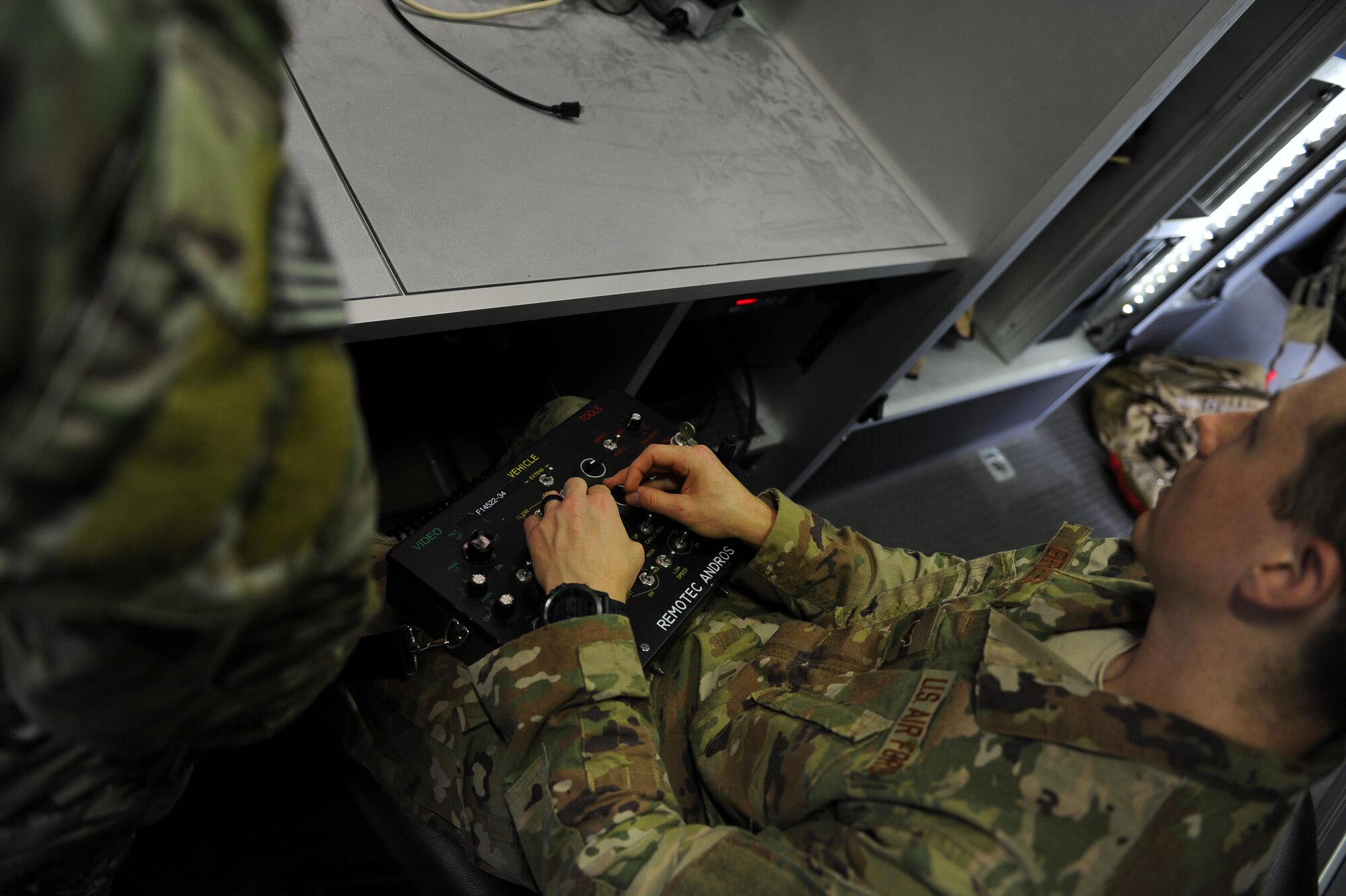 Airman 1st Class Lawrence Gress, an explosive ordnance disposal journeyman with the 1st Special Operations Civil Engineering Squadron, operates an F6A EOD robot at Hurlburt Field, Fla., June 21, 2017. EOD technicians use robots to disarm and dispose of explosives from a safe distance, minimizing the risk of injury or death during global operations. (U.S. Air Force photo by Airman 1st Class Isaac O. Guest IV)