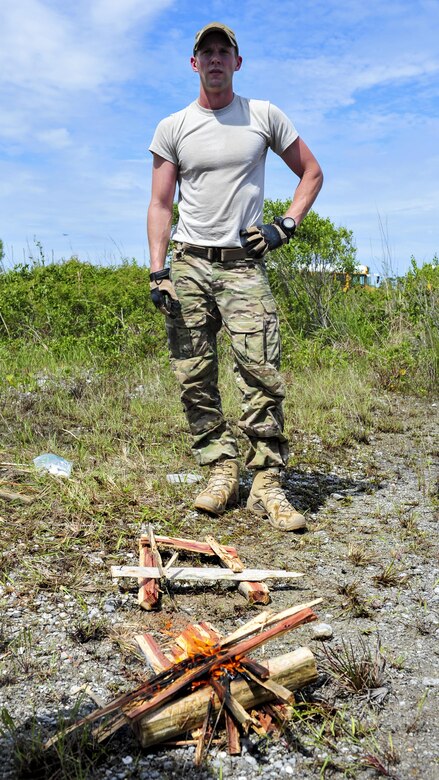 Staff Sgt. Casey Blackmon, a survival, evasion, resistance and escape specialist with the 1st Special Operations Support Squadron, explains fire-making principals to Junior ROTC cadets at Hurlburt Field, Fla., June 29, 2017. More than 50 cadets from five local high schools attended a Summer Leadership School course at Hurlburt Field, where they learned about leadership, teamwork and life in the military. (U.S. Air Force photo by Staff Sgt. Victor J. Caputo)