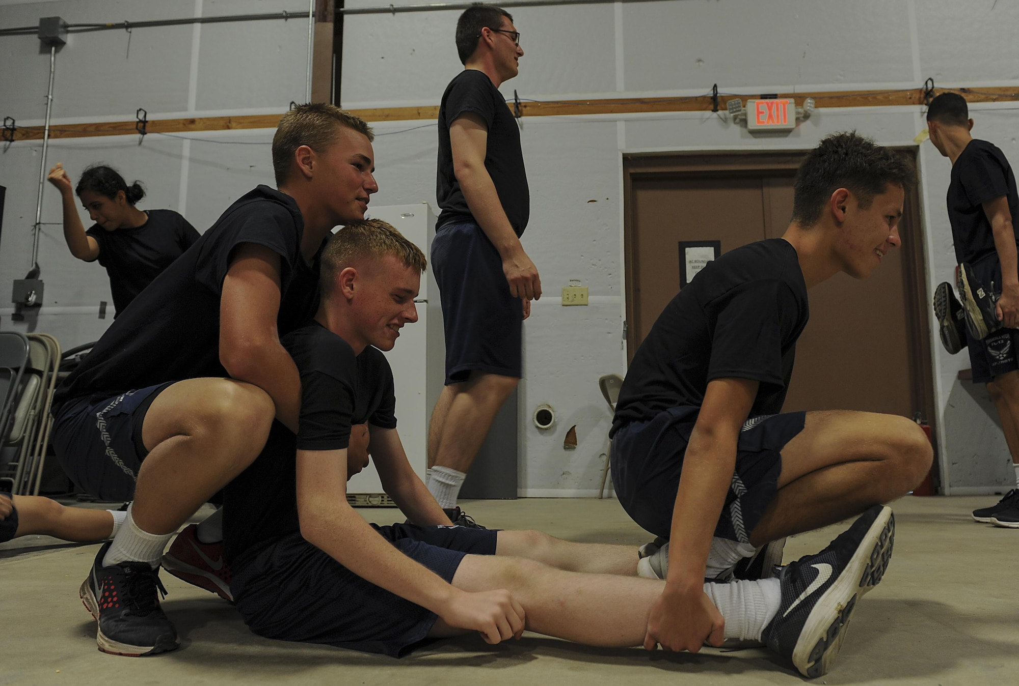Junior ROTC cadets practice the "before and after" carry while learning patient movements at Hurlburt Field, Fla., June 29, 2017. The 1st Special Operations Aerospace Medicine Squadron paired with more than 50 cadets to teach the basics of self-aid and buddy care during a Summer Leadership Course at Hurlburt Field. (U.S. Air Force photo by Airman 1st Class Rachel Yates)