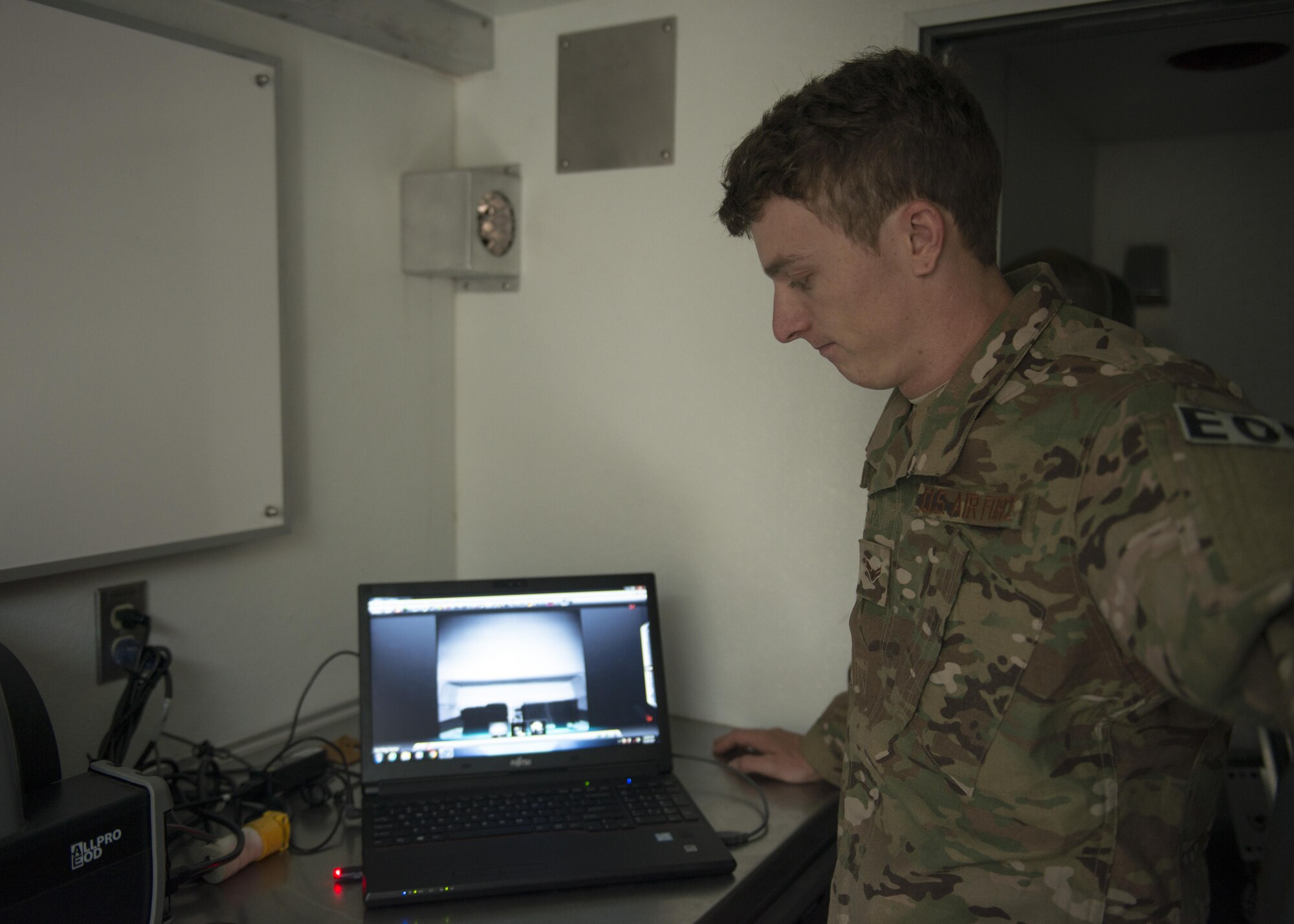 U.S. Air Force Airman 1st Class William Amershek, 7th Civil Engineer Squadron explosive ordnance disposal apprentice, checks the contents of a box using a digital x-ray machine at Dyess Air Force Base, Texas, June 28, 2017. The x-ray machine allows EOD technicians to closely examine the internal contents of any suspicious packages, possible improvised explosive devices or unexploded ordinances. (U.S. Air Force photo by Senior Airman Katherine Miller)