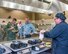 Maynard Oestreich, executive chef for Aramark prepares meals during the BIBIM Box tasting featuring Korean food at Sierra Inn Dining Facility, Travis Air Force Base, Calif., June 29, 2017. Oestreich a former U.S. Navy veteran and an award-winning chef from Napa Valley, Calif., took the head chef position so he could mentor young Airmen. (U.S. Air Force photo by Louis Briscese)