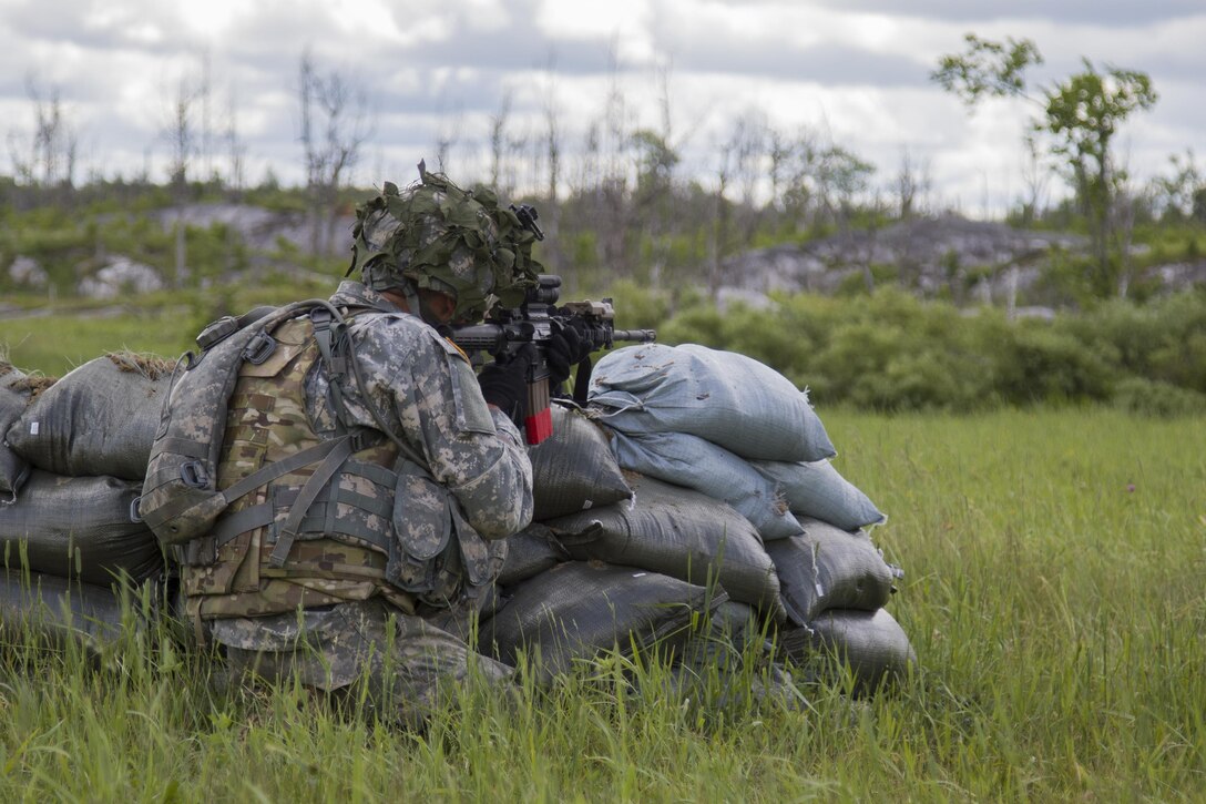 A Vermont Army National Guard member assaults an objective during a live-fire exercise at Fort Drum, N.Y., June 21, 2017. Army National Guard photo by Spc. Avery Cunningham