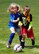 Children of military members test their soccer skills at the military youth soccer clinic June 25. (Air Force Photo/Paul Zadach)
