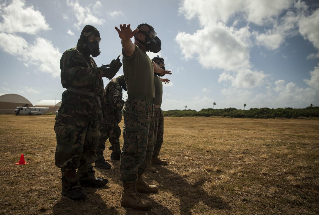 Marines assigned to Combat Logistics Battalion 3 scan Marines for chemical contamination after exiting the gas chamber aboard Marine Corps Base Hawaii on June 28, 2017. The gas chamber is a biennial training event that prepares Marines for when they’re exposed to chemical, biological, radiological or nuclear hazards. (U.S. Marine Corps photo by Lance Cpl. Matthew Kirk)
