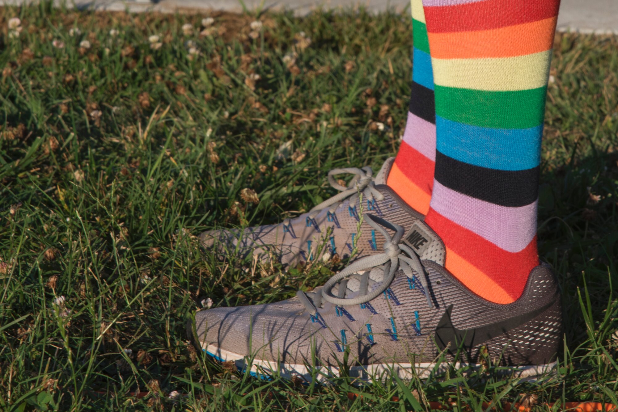 A base member wears rainbow socks during the Lesbian, Gay, Bisexual and Transgender Pride Month Five Kilometer Pride Run at Joint Base Andrews, Md., June 28, 2017. A common symbol of LGBT pride is the rainbow or pride flag.  (U.S. Air Force photo by Airman 1st Class Valentina Lopez)