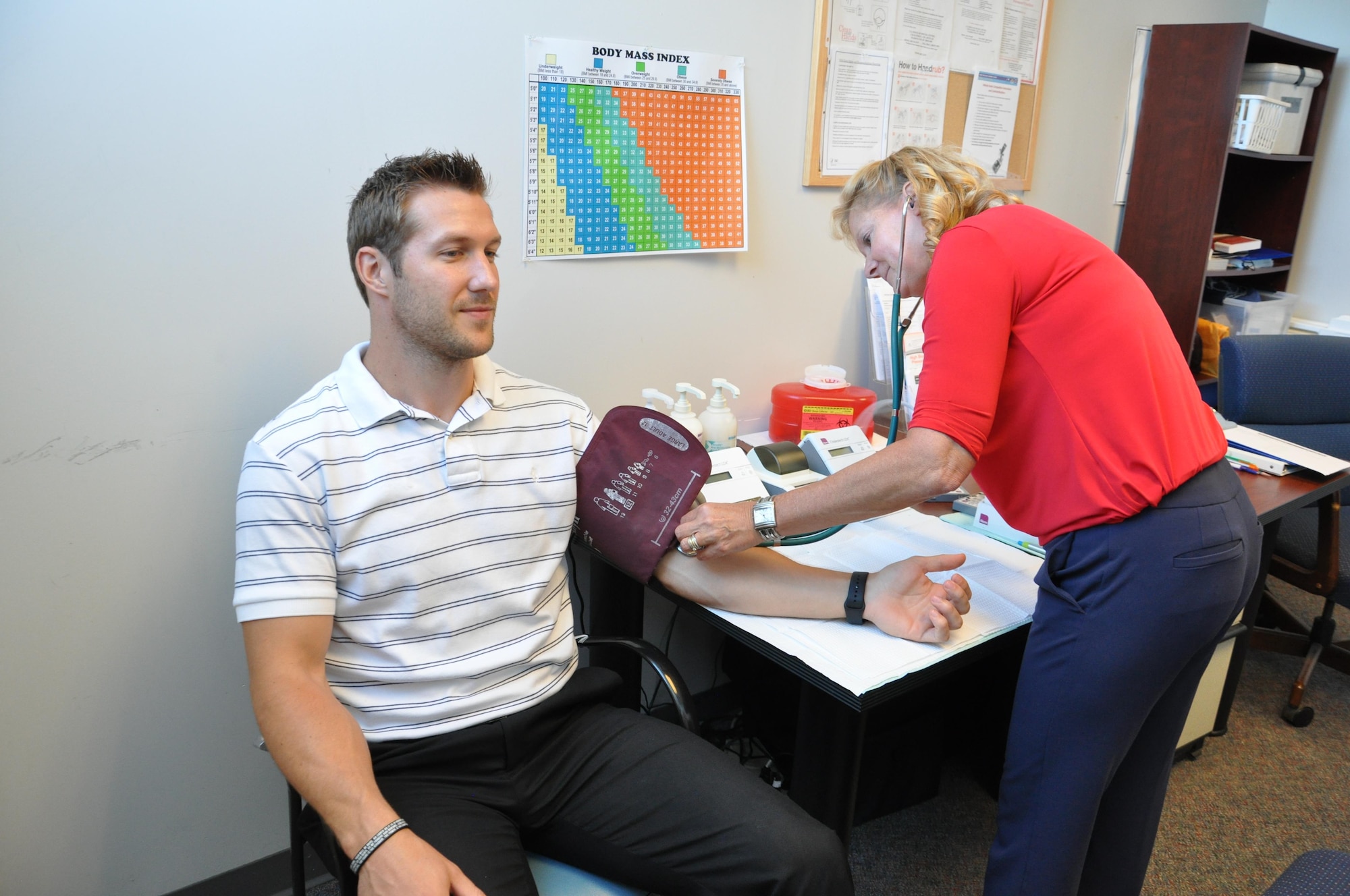 Drew Kuesel had his cholesterol checked recently by Karen McGinnis, health promotion specialist with Civilian Health Promotion Services. (U.S. Air Force photo/W. Eugene Barnett)   