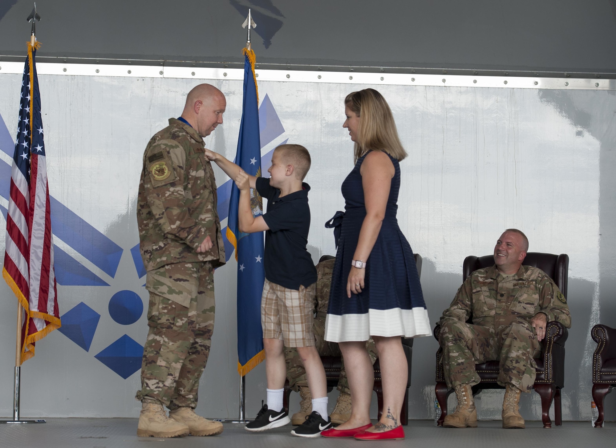 Family members tack on Chief Master Sgt. Brandon Dunston, 74th Aircraft Maintenance Unit superintendent, during a promotion ceremony, June 28, 2017 at Moody Air Force Base, Ga. During the ceremony, Brandon promoted to chief master sergeant and his older cousin, then Maj. Christopher Dunston, 723d Aircraft Maintenance Squadron commander, promoted to lieutenant colonel. According to Brandon, the pair has been waiting more than 19 years since his day of enlistment to be stationed together. (U.S. Air Force photo by Airman 1st Class Lauren M. Sprunk)