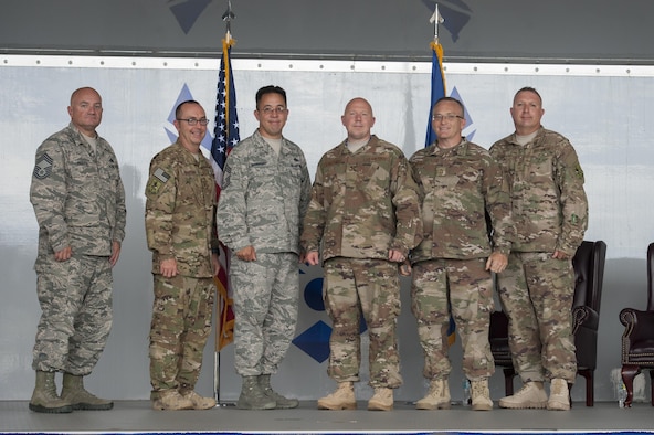 Moody Chiefs pose for a photo during a promotion ceremony, June 28, 2017, at Moody Air Force Base, Ga. During the ceremony, then Maj. Christopher Dunston, 723d Aircraft Maintenance Squadron commander, promoted to lieutenant colonel and his younger cousin, then Senior Master Sgt. Brandon Dunston, 74th Aircraft Maintenance Unit superintendent, promoted to chief master sergeant. (U.S. Air Force photo by Airman 1st Class Lauren M. Sprunk)