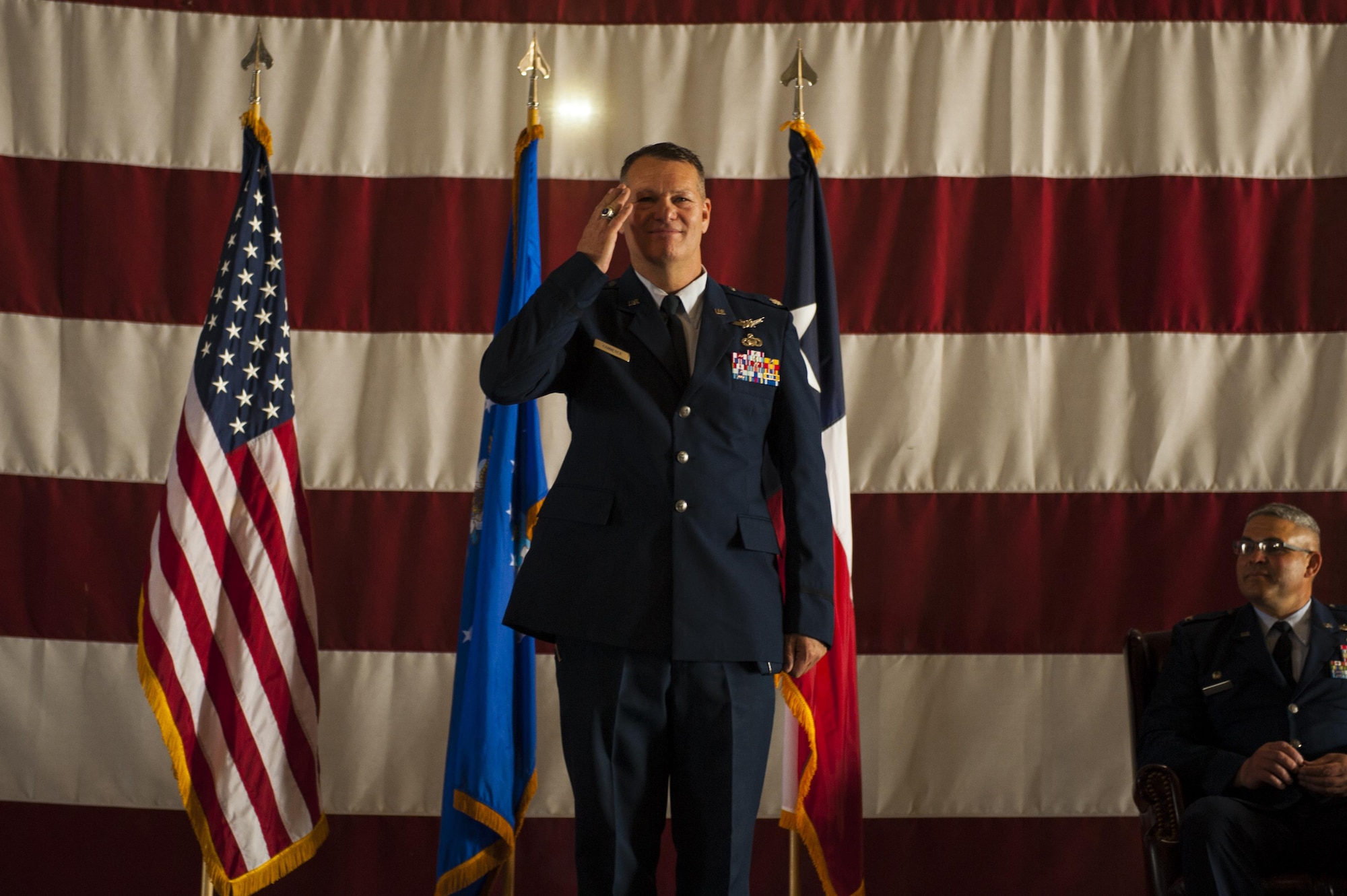 U.S. Air Force Lt. Col. Robert Kammerer, 316th Training Squadron Commander, salutes the 316th TRS for the first time during the 316th TRS Change of Command at the Fire Academy high bay on Goodfellow Air Force Base, Texas, June 30, 2017. The change of command ceremony is a time honored military tradition that signifies the orderly exchange of authority. (U.S. Air Force photo by Senior Airman Scott Jackson/Released)