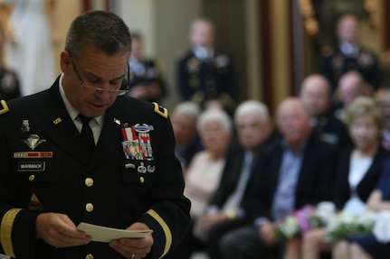 Brig. Gen. Michael Warmack, Chief of Army Reserve Command Operations, Plans and Training, checks his notes during his retirement ceremony at Fort Bragg, N.C., June 29, 2017. Warmack honored  his wife and parents during the ceremony, especially his mother, Toni, who he credits as being an instrumental part of his life. (U.S. Army Reserve photo by Staff Sgt. Felix R. Fimbres)